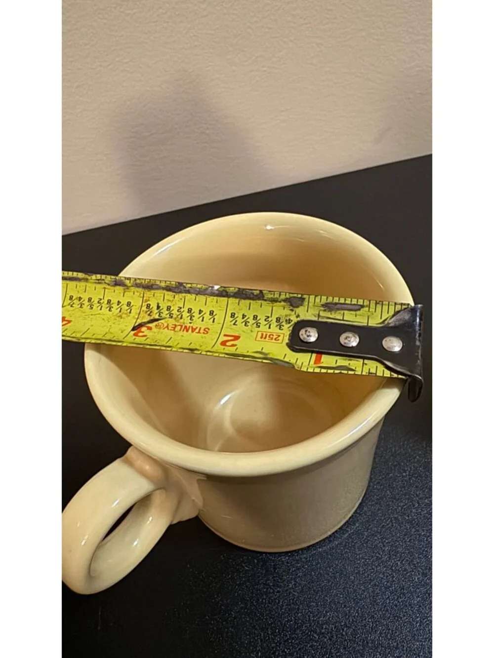 Pair of Fiesta Ware mugs in a light yellow glaze